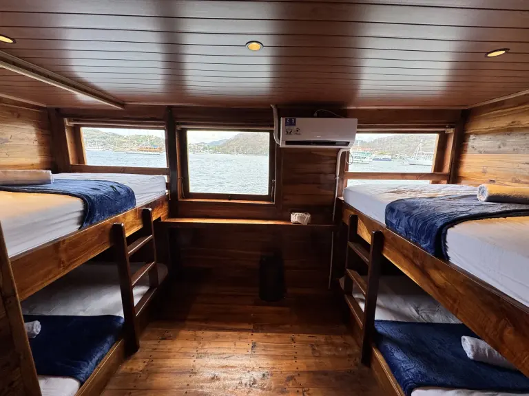 An Aimar Share Cabin with four single beds in two bunks
