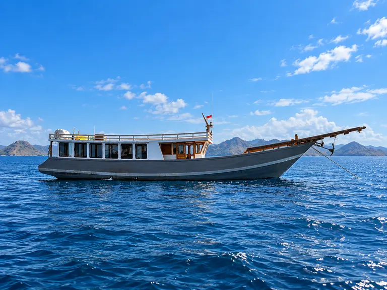 Ayayay, a wooden boat with a grey hull in Komodo National Park waters